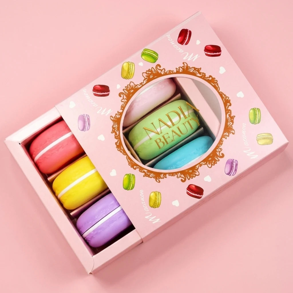 Colorful macaron-shaped lip balm set in a decorative box with 'Nadia Beauty' branding on a pink background.