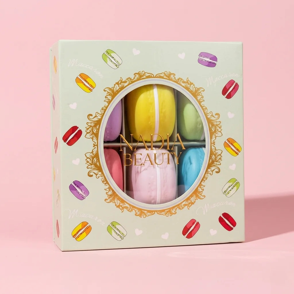 Nadia Beauty macaron lip balm set in a decorative box with colorful macaron illustrations on a pink background