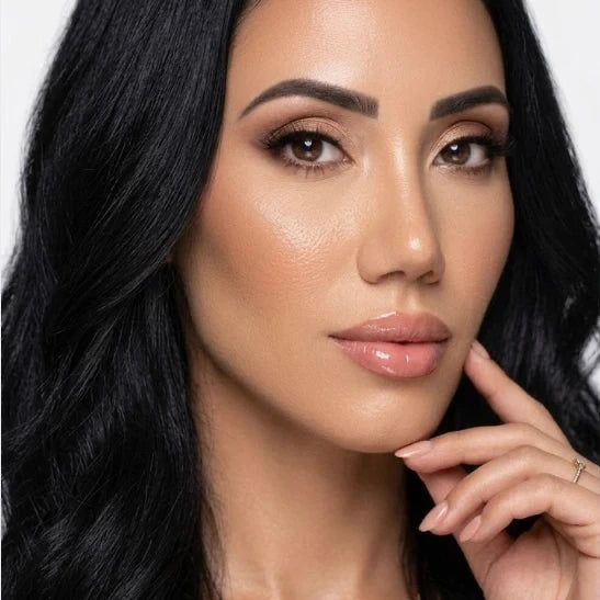 Woman wearing mango lip balm on a white background